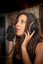 Girl sings in the recording studio