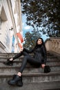 Young girl sits on the stairs. Beautiful woman. Poland. Warsaw