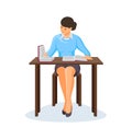 Young girl sits at a table studying books.