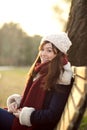 Young girl sitting on bench in a park Royalty Free Stock Photo