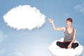 Young girl sitting on cloud and thinking of abstract speech bubble with copy space Royalty Free Stock Photo