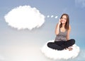 Young girl sitting on cloud and thinking of abstract speech bubble with copy space Royalty Free Stock Photo