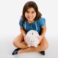 Young girl holding a piggybank Royalty Free Stock Photo