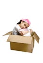A young girl sitting quietly in a box