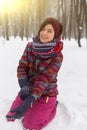 Young girl sitting on snow Royalty Free Stock Photo