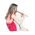 Young girl sitting with soprano recorder