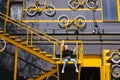 A young girl is sitting on the stairs against the background of a creative building