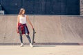 Girl skateboarder in skateboard park