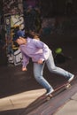 Young girl skater performing tricks at the Southbank Skate Space