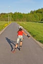 Young girl skating away Royalty Free Stock Photo