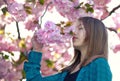 Young girl smelling blossoms Royalty Free Stock Photo