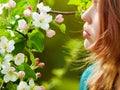 Young girl smelling blossoms Royalty Free Stock Photo