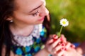 Young girl smelling a flower Royalty Free Stock Photo