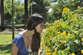 Young girl smelling flowers Royalty Free Stock Photo