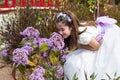 Young girl smelling flowers Royalty Free Stock Photo