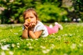 Young girl smelling yellow Buttercup flower on meadow Royalty Free Stock Photo