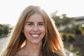 Young girl smiling on camera having fun outdoor in the city - Focus on face Royalty Free Stock Photo