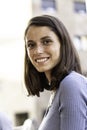 Young girl smiling on camera having fun outdoor in the city - Focus on face Royalty Free Stock Photo