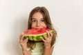 Young girl smiling and eating ripe watermelon. Healthy eating. Royalty Free Stock Photo