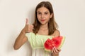 Young girl smiling and eating ripe watermelon. Healthy eating. Royalty Free Stock Photo