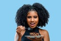 Young girl smiling while holding a dessert Italian straw pie,