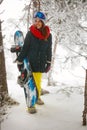 Girl snowboarder going through in the fog winter forest Royalty Free Stock Photo