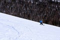 Young girl snowboarder in motion on snowboard in mountains Royalty Free Stock Photo