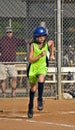 Young Girl Softball Player Running to First Base Royalty Free Stock Photo