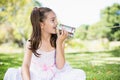 Young girl speaking through tin can phone Royalty Free Stock Photo