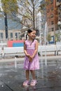 Young Girl at a Splash Fountain