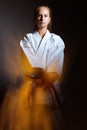 Young girl in a sports kimono in the image of judo. Royalty Free Stock Photo