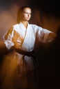 Young girl in a sports kimono in the image of judo. Royalty Free Stock Photo