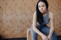 Young girl in sportswear in a gym in a simple background, a theme of fitness, a crossover and sport Royalty Free Stock Photo