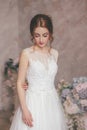 Young girl in spring in a luxurious white dress.