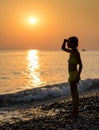 Young girl on shore sea Royalty Free Stock Photo