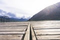 young girl standing alone in the center of the frame looking out towards the seat. Peaceful and beautiful landscape. A long Royalty Free Stock Photo