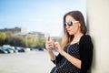 Young girl standing on the college campus yard leaning oncolumn Royalty Free Stock Photo