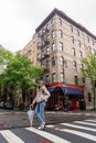 Young girl is standing on the corner of Bedford Street with Grove Street in Greenwich Village Royalty Free Stock Photo