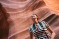 Young girl standing in the desert cave looking up Royalty Free Stock Photo