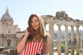 Young girl standing in ruins of Roman Forum background in Rome, Italy. Royalty Free Stock Photo