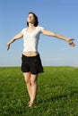 Young girl standing on summer lawn Royalty Free Stock Photo