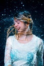 The young girl standing under running water Royalty Free Stock Photo