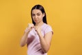 Young girl stands in fighting stance