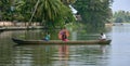 Young girl steering the family boat