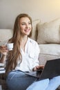 Young girl student bisinesswoman spend time at home working and studying and calling on mobile phone