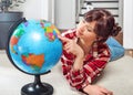 Young girl student study geography with globe