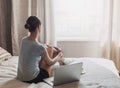 Young girl or student using laptop at home. Woman working on computer Royalty Free Stock Photo