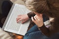 Young girl studying for a laptop at home