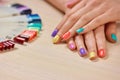 Young girl summer colored manicure. Royalty Free Stock Photo