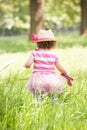 Young Girl In Summer Dress Sitting In Field Royalty Free Stock Photo